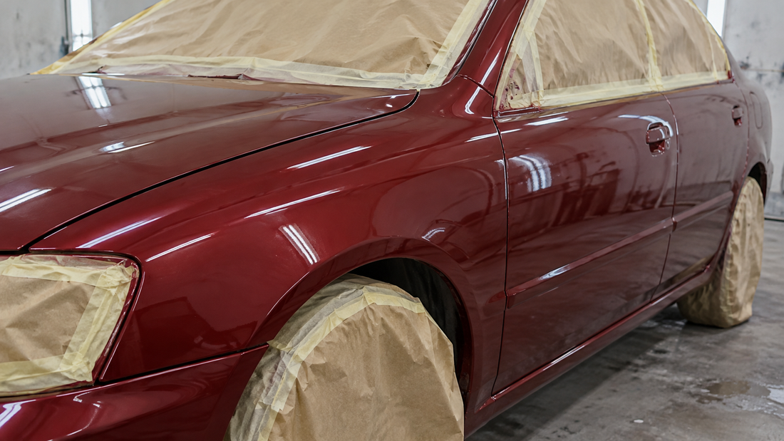 Painted vehicle in paint booth